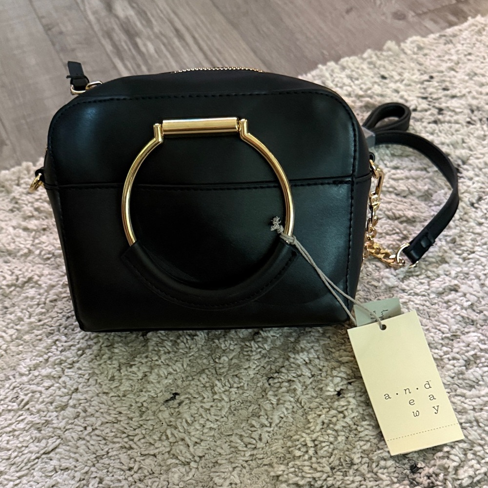 A New Day Black Crossbody Bag with Gold Ring Accent